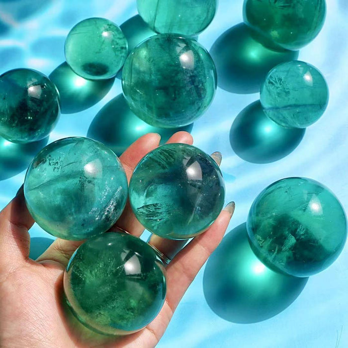 green fluorite crystal spheres with rainbow