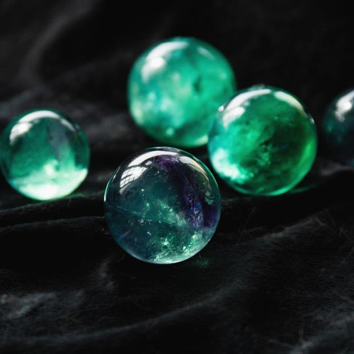 green fluorite crystal spheres with rainbow