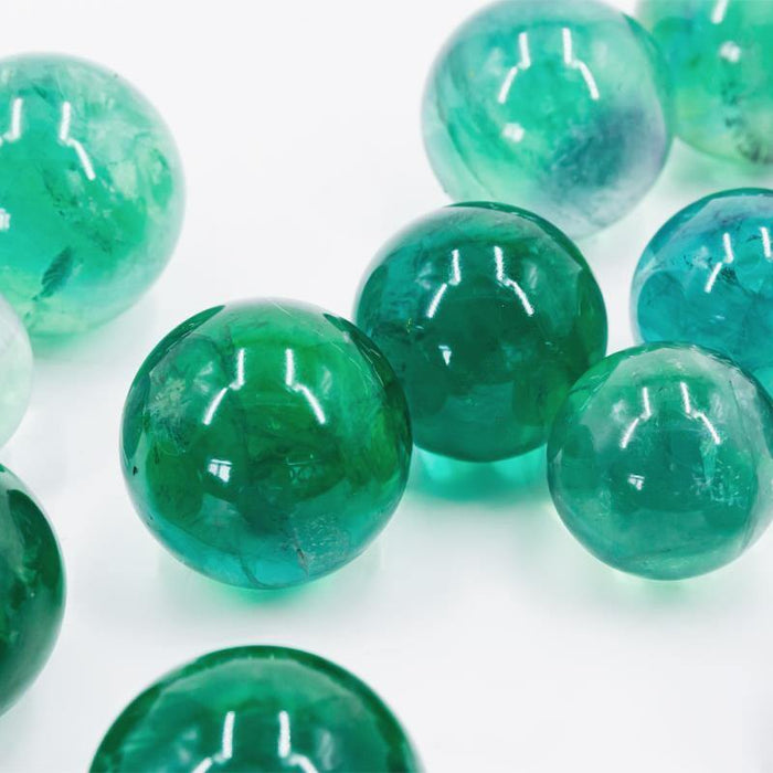 green fluorite crystal spheres with rainbow
