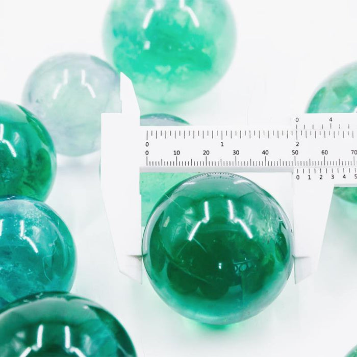 green fluorite crystal spheres with rainbow